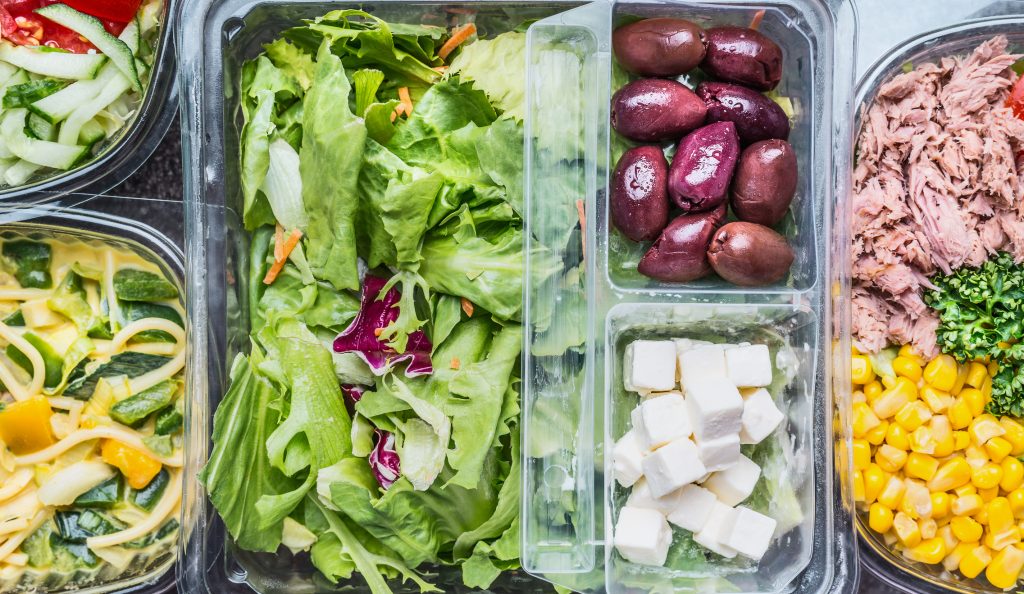 plastic containers of produce and meat. FDA and USDA are responsible for overseeing these foods.