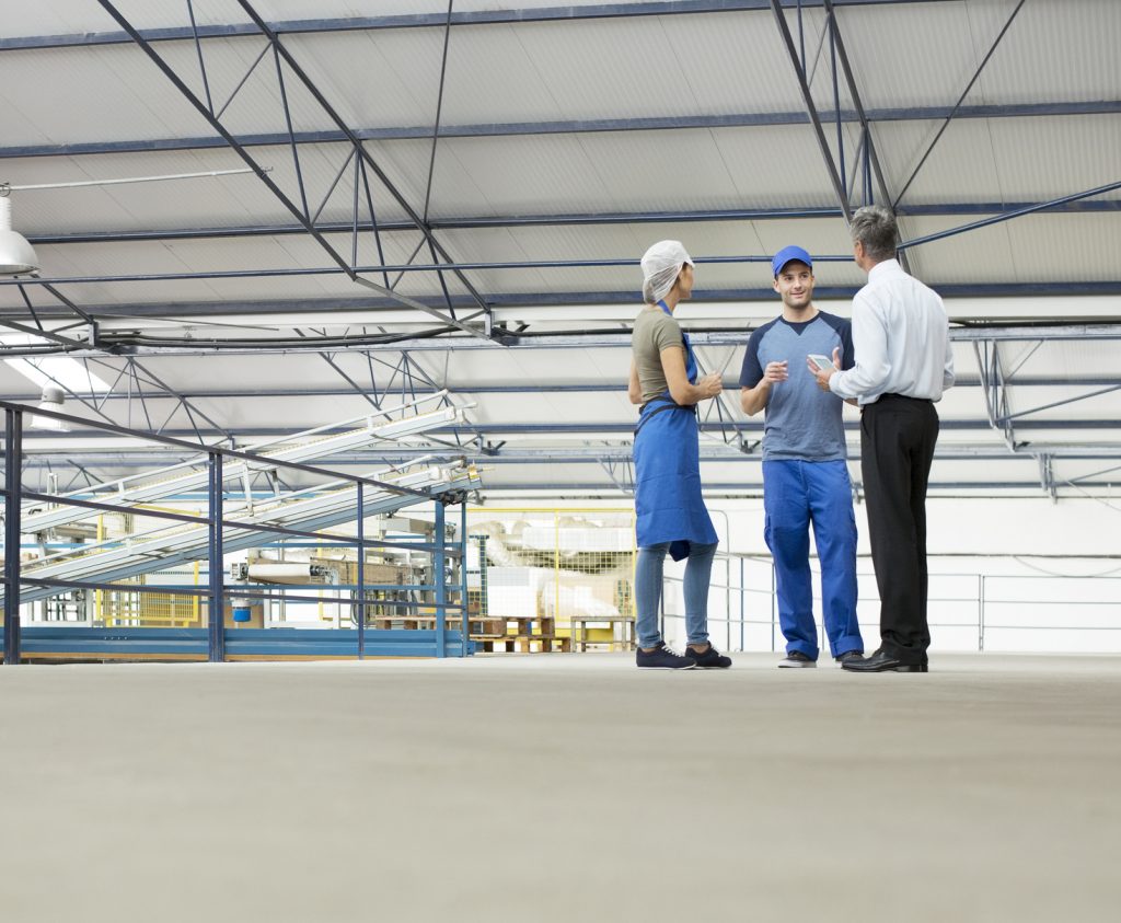 Supervisor and workers at a Due Diligence onsite assessment at a factory.