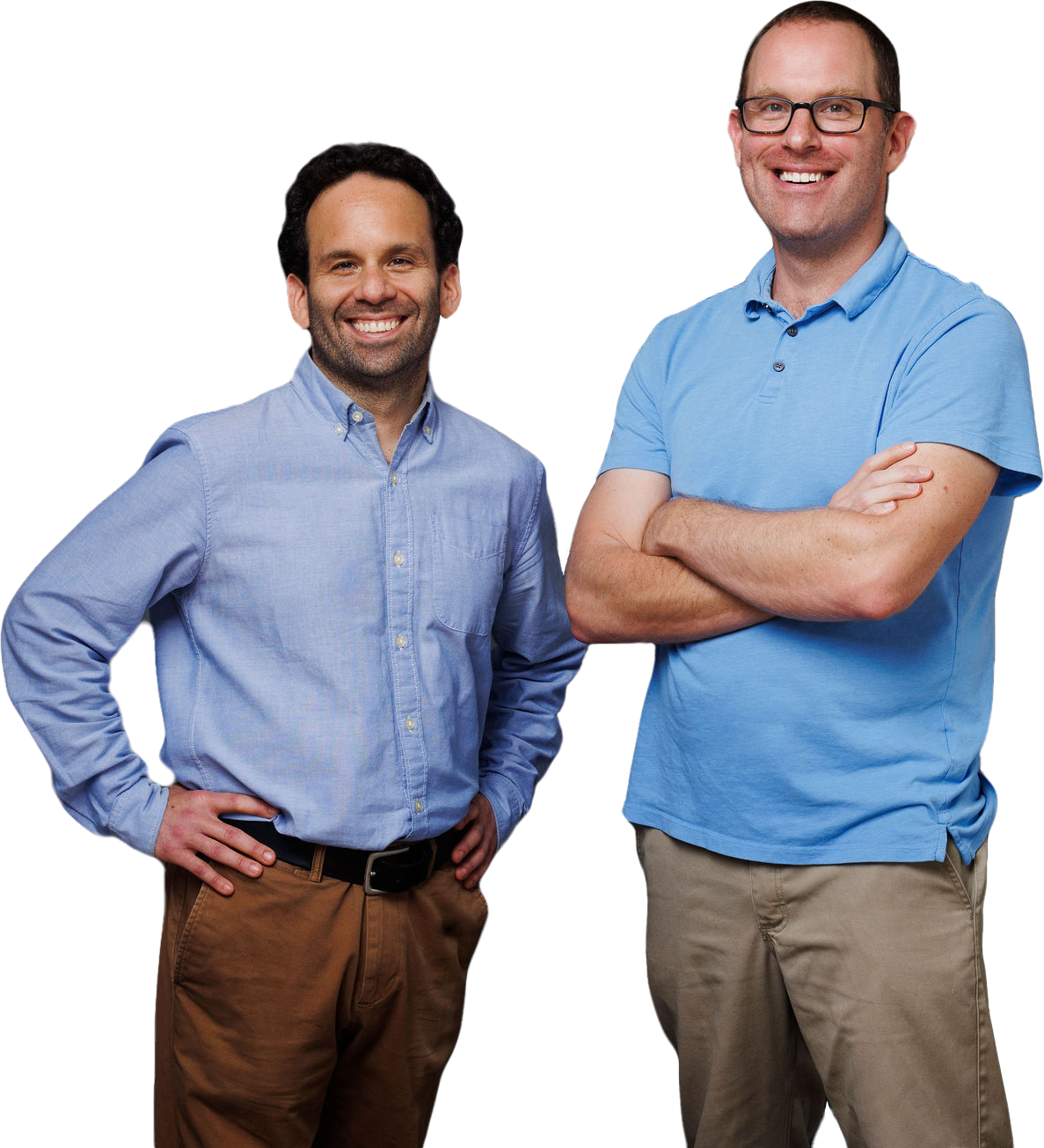 Mickey and Brian Kellerman, Co-founders of Kellerman Consulting standing together wearing blue shirts and smiling.